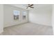 Bright bedroom with neutral carpeting and natural light from the two windows with views of outdoors at 5441 Ellsworth Dr, Plainfield, IN 46168
