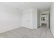 Carpeted bedroom featuring a large closet and a doorway leading to an adjoining room at 5441 Ellsworth Dr, Plainfield, IN 46168