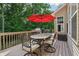 Spacious deck includes an outdoor seating area perfect for enjoying the serene backyard and outdoor dining at 5441 Ellsworth Dr, Plainfield, IN 46168