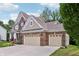 Brick and siding home with attached garage and well-maintained landscaping at 5441 Ellsworth Dr, Plainfield, IN 46168