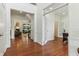 Bright foyer showcasing hardwood floors, white trim and entryways leading to living spaces at 5441 Ellsworth Dr, Plainfield, IN 46168