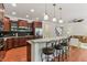 Open kitchen with granite counters, stainless appliances, and a breakfast bar that flows into the living space at 5441 Ellsworth Dr, Plainfield, IN 46168