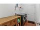 Efficient laundry room with front-loading washer and dryer and cabinet for storage at 5441 Ellsworth Dr, Plainfield, IN 46168