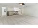 Bright loft area featuring neutral carpeting, a ceiling fan, and iron railing overlooking the entry at 5441 Ellsworth Dr, Plainfield, IN 46168