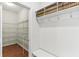 Well-organized mudroom with built-in shelving, coat hooks, and a bench for added convenience at 5441 Ellsworth Dr, Plainfield, IN 46168