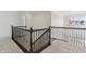 Second floor landing with wooden handrail and overhead chandelier at 5441 Ellsworth Dr, Plainfield, IN 46168