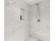 Inviting tile shower with a handheld shower head and recessed shelving for toiletries and bathroom necessities at 5441 Ellsworth Dr, Plainfield, IN 46168