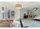 Light sitting area adjacent to main bedroom, with access to outdoor deck and neutral colored walls at 5441 Ellsworth Dr, Plainfield, IN 46168