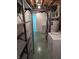 Basement utility area displaying laundry setup, water heater, and shelving, offering practical storage solutions at 5807 Sunwood Dr, Indianapolis, IN 46224