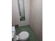 Bathroom area includes toilet, sink, and mirror, showcasing a basic yet functional layout at 5807 Sunwood Dr, Indianapolis, IN 46224