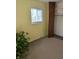 Bedroom features a window, closet, and neutral carpet flooring, offering a cozy and functional space at 5807 Sunwood Dr, Indianapolis, IN 46224
