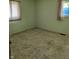 Bedroom with vintage-style carpet and natural light from two windows at 5807 Sunwood Dr, Indianapolis, IN 46224
