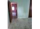 Bedroom featuring dated green walls and door frame with carpet at 5807 Sunwood Dr, Indianapolis, IN 46224