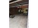 Garage interior featuring bare framing, offering storage and parking space at 5807 Sunwood Dr, Indianapolis, IN 46224
