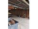 Spacious garage with exposed beams, concrete floor, and storage potential at 5807 Sunwood Dr, Indianapolis, IN 46224