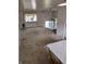View of living room featuring ample natural light and a staircase to the upper level at 5807 Sunwood Dr, Indianapolis, IN 46224