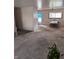 Spacious living area with adjacent dining area and front door at 5807 Sunwood Dr, Indianapolis, IN 46224