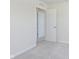 Light-filled bedroom showcasing plush carpet and access to another room via a paneled door at 7151 Stetson Dr, Whitestown, IN 46052