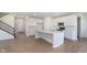 Bright kitchen with quartz counters, white cabinets, and stainless steel appliances at 7151 Stetson Dr, Whitestown, IN 46052