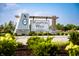 Hampton Walk community sign featuring a light blue, white, and stone aesthetic at 7333 Bayview Run, McCordsville, IN 46055