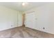 Bedroom featuring carpeted floor, a ceiling fan and closet doors at 7405 N Janna Dr, Muncie, IN 47303