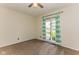 Bright bedroom featuring carpeted floor, a ceiling fan and a sliding door at 7405 N Janna Dr, Muncie, IN 47303