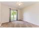 Bedroom featuring carpeted floor, a ceiling fan and a large window at 7405 N Janna Dr, Muncie, IN 47303