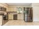 Modern kitchen with stainless steel appliances, tile backsplash, and granite countertops at 7405 N Janna Dr, Muncie, IN 47303