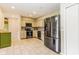 Well-lit kitchen with stainless steel appliances, tile backsplash, and ample counter space at 7405 N Janna Dr, Muncie, IN 47303