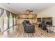 Spacious living room with wood floors, fireplace, and sliding door to patio at 7405 N Janna Dr, Muncie, IN 47303