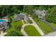 Aerial view of two houses on large lots with a pool, circular driveway, and mature trees at 7554 Silverpine Ct, Indianapolis, IN 46250