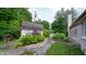 Backyard shed surrounded by lush landscaping and a view of the pool and house at 7554 Silverpine Ct, Indianapolis, IN 46250