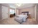 Cozy bedroom with a comfortable bed, a well-lit desk, and neutral decor; perfect for guests at 7554 Silverpine Ct, Indianapolis, IN 46250