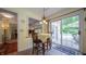 Eat-in area with a table, decorative lighting, and a sliding glass door to outdoor living at 7554 Silverpine Ct, Indianapolis, IN 46250