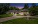 Stunning front exterior with a curved driveway, manicured lawn, and a home with unique architectural details at 7554 Silverpine Ct, Indianapolis, IN 46250