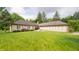 Lovely exterior showcases manicured landscaping, green lawn, and unique architecture of the home at 7554 Silverpine Ct, Indianapolis, IN 46250