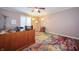 Well-appointed office space with modern desk, colorful rug, and ample lighting for a productive work environment at 7554 Silverpine Ct, Indianapolis, IN 46250
