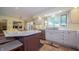 Bright kitchen showcases white cabinets, stainless steel appliances, and a large window for natural light at 7554 Silverpine Ct, Indianapolis, IN 46250