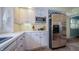 Kitchen featuring white cabinets, stainless steel appliances, and convenient wine rack at 7554 Silverpine Ct, Indianapolis, IN 46250
