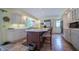 Eat-in kitchen area features a center island with seating, stainless steel appliances, and ample counterspace at 7554 Silverpine Ct, Indianapolis, IN 46250