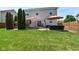 Spacious backyard with a well-maintained lawn, deck, patio, mature trees, and fenced perimeter at 7733 Chestnut Eagle Ct, Zionsville, IN 46077