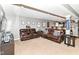Finished basement offers a spacious seating area with leather furniture and recessed lighting at 7733 Chestnut Eagle Ct, Zionsville, IN 46077