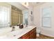 Bathroom featuring double sinks, large mirror, and natural light from the window at 7733 Chestnut Eagle Ct, Zionsville, IN 46077