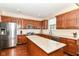 Well-equipped kitchen featuring stainless steel appliances and granite countertops at 7733 Chestnut Eagle Ct, Zionsville, IN 46077