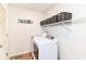 Bright laundry room with modern washer and dryer, and ample storage space at 7733 Chestnut Eagle Ct, Zionsville, IN 46077