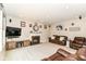 Cozy living room featuring a fireplace and plush leather seating at 7733 Chestnut Eagle Ct, Zionsville, IN 46077