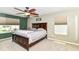 Comfortable main bedroom with ceiling fan and two large windows at 7733 Chestnut Eagle Ct, Zionsville, IN 46077