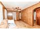 A living room featuring wood paneling, carpet and furniture at 7829 Rahke Rd, Indianapolis, IN 46217