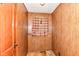 A room featuring wood paneling and a window at 7829 Rahke Rd, Indianapolis, IN 46217