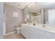 Bathroom featuring double sink vanity, large mirror, and tile surround shower at 8425 Codesa Way, Indianapolis, IN 46278
